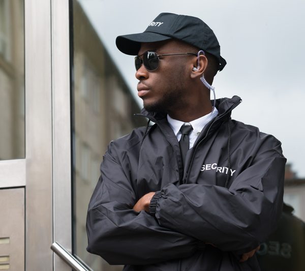 CCTV Camera In Open Plan Blurry Office.