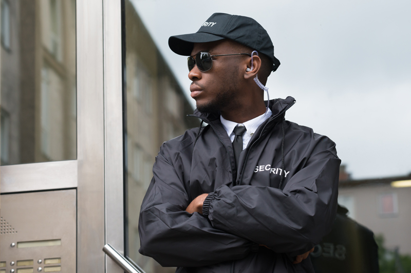 Armed guard providing protective presence at corporate entrance — Providers International